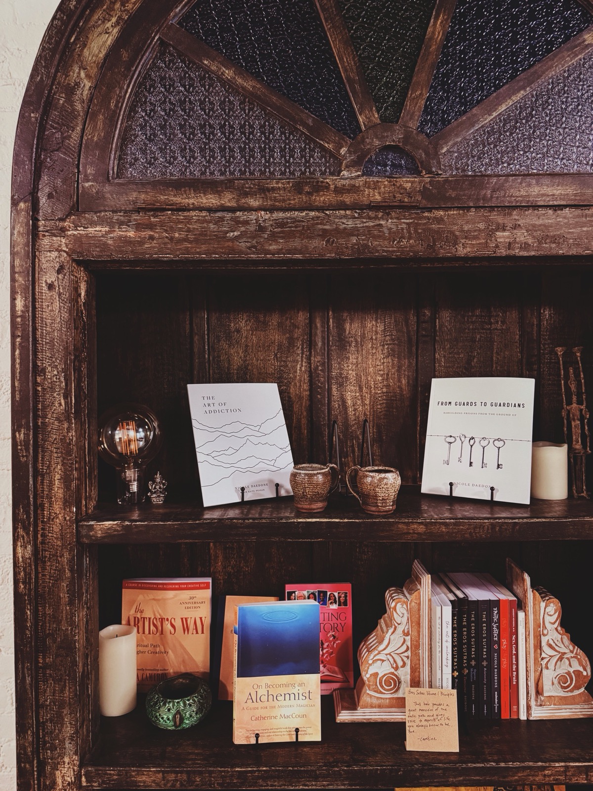 A bookshelf filled with books selected for discussion