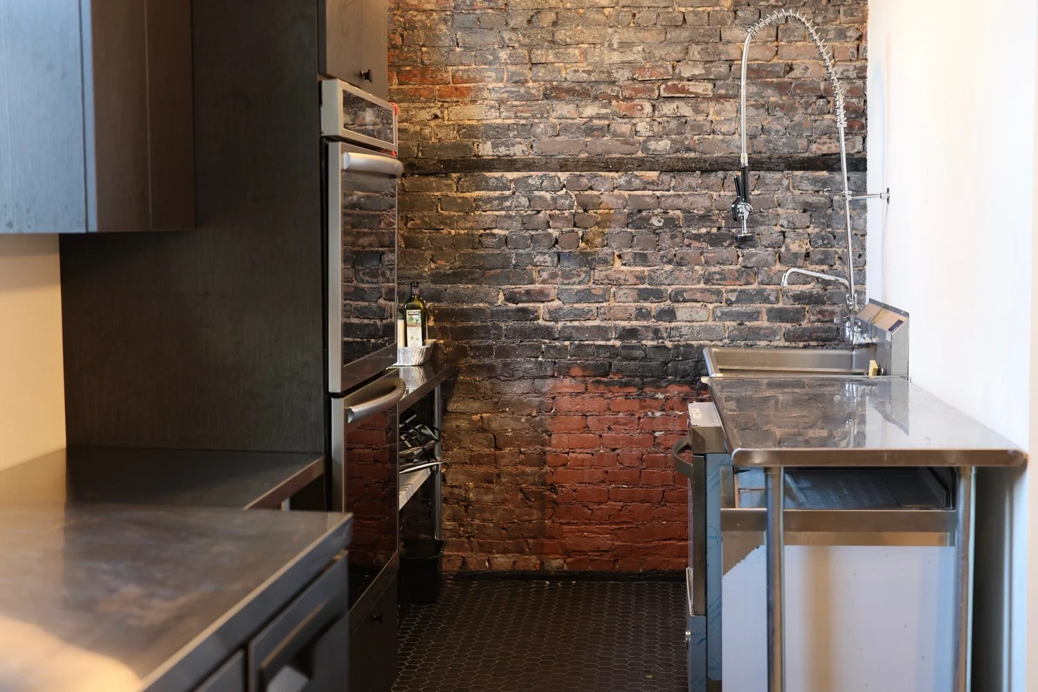 The catering kitchenette with double oven and prep surfaces